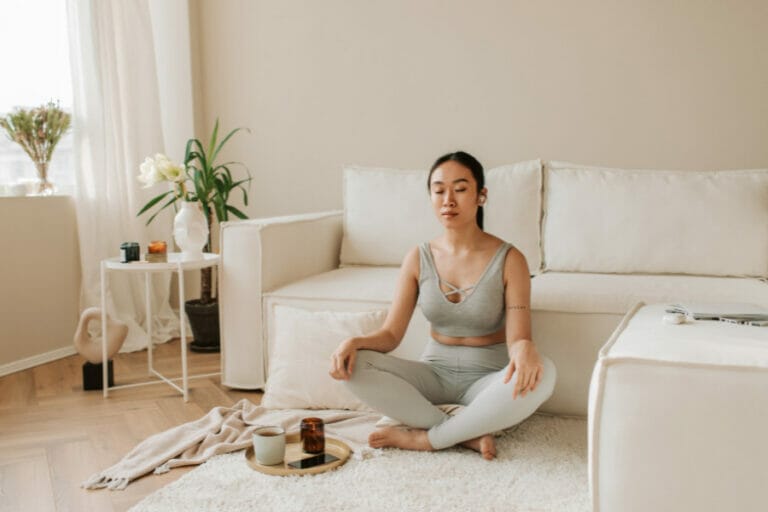 mom practicing self care through meditating