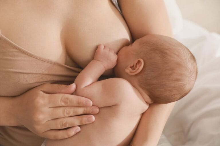 mom breastfeeding newborn baby