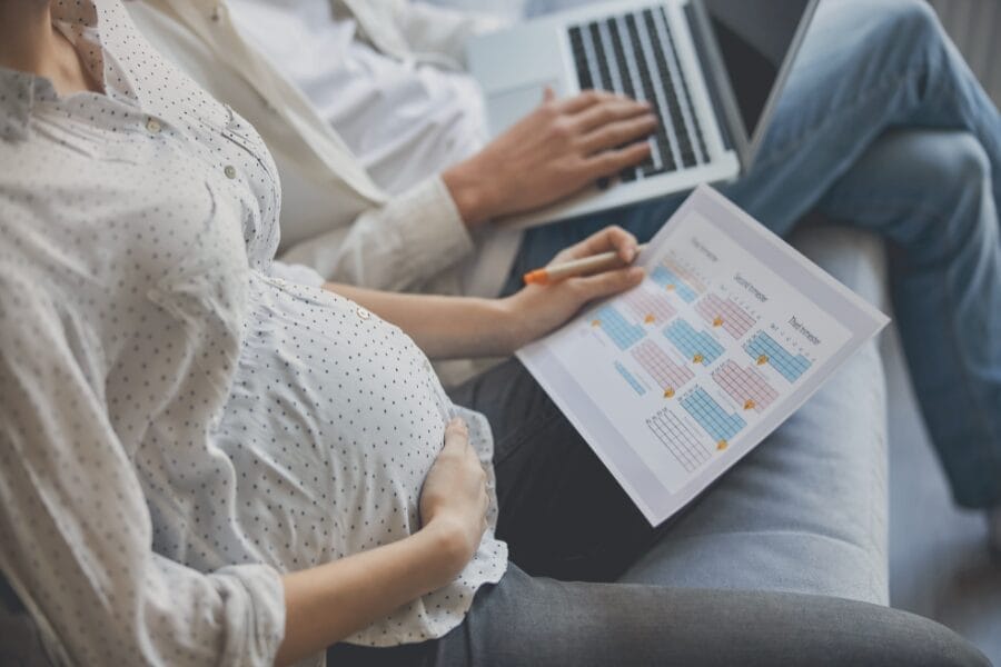 pregnant woman reviewing a postpartum plan